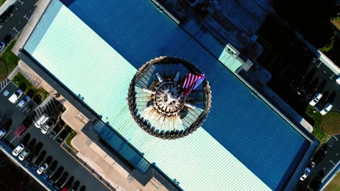 Aerial Top Panning View Of Flags On Tennessee State Capitol By Vehicles In City Stock Footage 250436706
