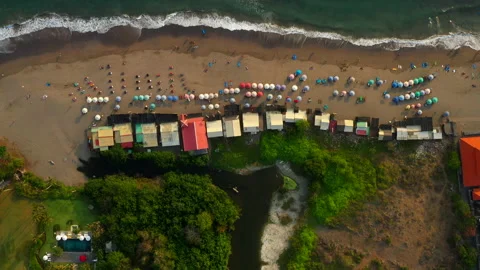 Aerial Top Shot Of Multi Colored Parasols At Beach, Drone Flying Backwards Over Stock Footage 204067638