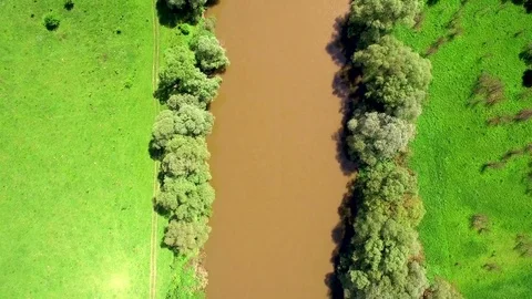 Aerial Top View 4k. Flying over the beautiful River. Aerial camera shot Stock Footage 77047745