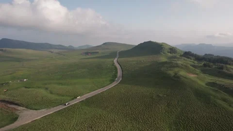 Aerial top view above Transbucegi winding road, in Transylvania	 Stock Footage 247006596