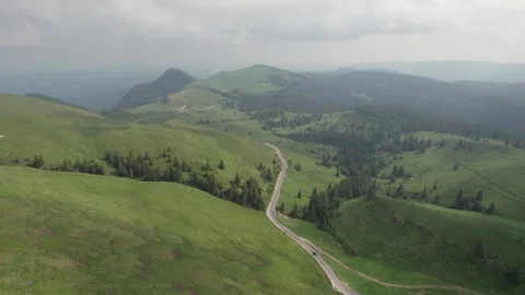 Aerial top view above Transbucegi winding road, in Transylvania	 Stock Footage 247006716