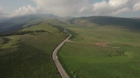 Aerial top view above Transbucegi winding road, in Transylvania	 Stock Footage 247006725