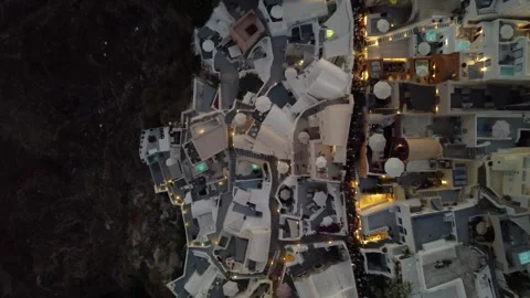 Aerial Top View after Sunset over Cliffside of Oia Village, Santorini, Stock Footage 264855739