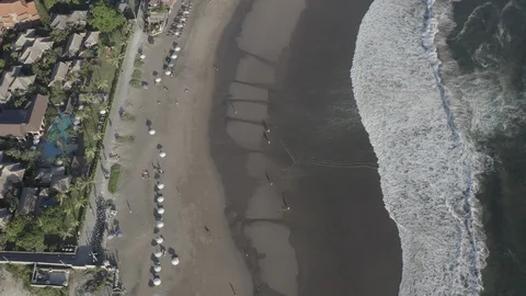 Aerial top view of beach with people surfing in bali indonesia Stock Footage 113107053