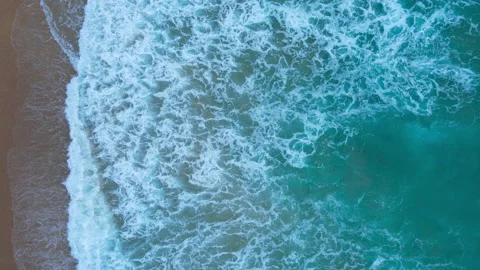 Aerial top view beach sea sand many levels crystal water wave background Stock Footage 173025053