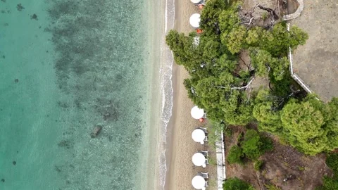 Aerial Top View of Beach with Sun Umbrellas and Turquoise Sea, Greece Stock Footage 327728946