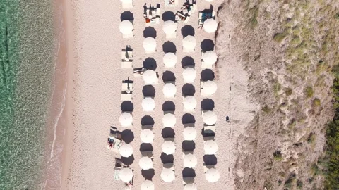 Aerial Top View of Beach Umbrellas and Loungers on Sardinia Coastline, Italy Stock Footage 339377020