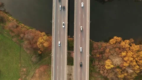Aerial top view of bridge road over the river with car traffic, city Stock Footage 133962829