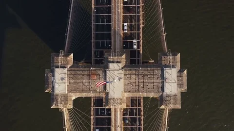 Aerial top view of Brooklyn bridge in New York, America. Drone flying up over Stock Footage