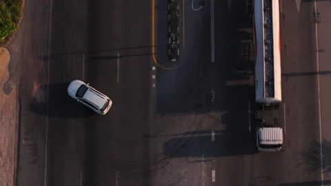 Aerial Top View of Car making U turn maneuver on Divided Highway at Designated Stock Footage 314883200
