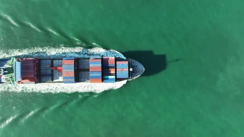 Aerial top view of cargo maritime ship with contrail in the ocean ship carryi Stock-Footage 171676601