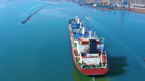 Aerial top view of cargo ship running with tug boat for export goods from cargo Stock Footage 167135293