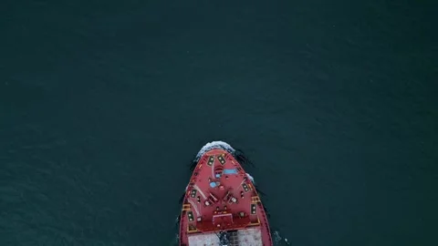 Aerial top view of a cargo ship sailing in open sea, showing colorful containers Stock Footage 319741432