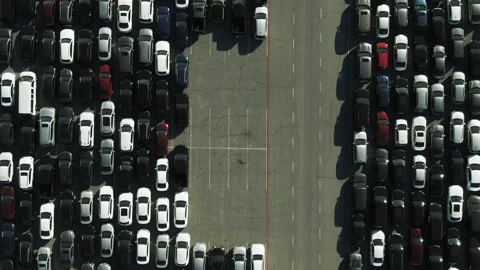 Aerial Top View Of Cars At Sports Venue Parking Lot On Sunny Day, Drone Panning Stock Footage