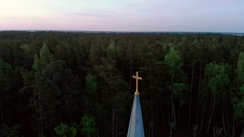 Aerial top view circle around cross of beautiful church in Jurmala during Golden Stock Footage 108325382