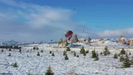 Aerial. Top View To The Colourful Hot Air Balloon Flying Above Winter Landscape Stock Footage