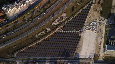 Aerial top view of constructed solar farm juxtaposed with highway, solar panels Stock Footage 271092285