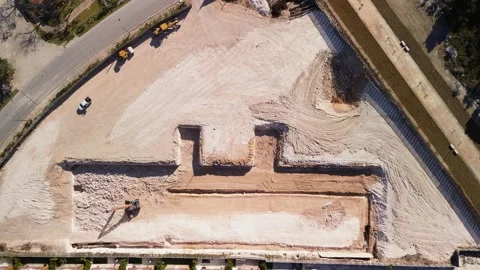 Aerial top view of construction site shows dug-out area for building foundation Stock Footage 271369813