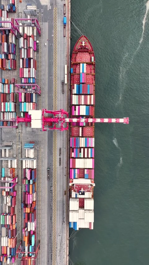 Aerial top view of a container ship unloading cargo at the port 스톡 동영상 340581695