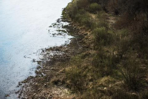 Aerial top view, countryside spring panorama of small quiet river on sunny da Stock Photos