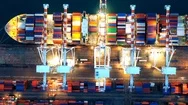 Aerial Top View Crane Shipping Container At Night. Stock Footage