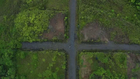Aerial top view of a crosspoint of two dirt roads, making a perfect cross Stock Footage 160316647