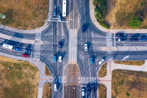 Aerial top view of crossroads with lot of vehicles or car traffic, modern urb Stock Photos