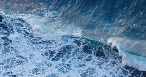 Aerial Top View Deep Ocean Water Texture with rolling and crashing waves Stock Footage 334015683