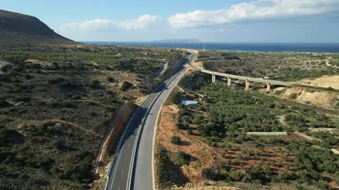 Aerial top view by drone of cretan landscape with cars on the road. Stock Footage 147129073