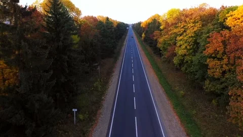 Aerial top view drone flight above cars driving by countryside village road Stock Footage 218201978