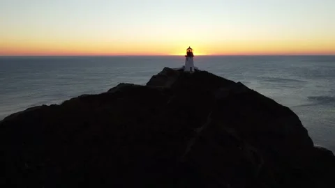Aerial Top View A Drone Of Lighthouse In Sunshine on Cape Bryner, 4K 動画素材 220533684
