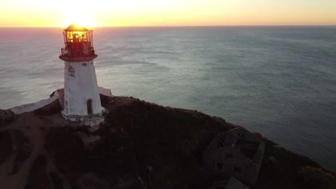 Aerial Top View A Drone Of Lighthouse In Sunshine on Cape Bryner, 4K 動画素材 220533704