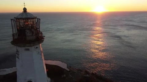 Aerial Top View A Drone Of Lighthouse In Sunshine on Cape Bryner, 4K 動画素材 220533709