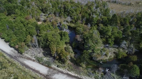 Aerial top view Drone Scene of a valley with a dirt road in a sunny day 스톡 동영상 89824285
