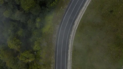 Aerial top view empty misty road in mountain Stock Footage 118724010