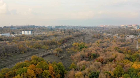 Aerial top view of empty single-way railway at autumn in suburb. Stock Footage 97490403
