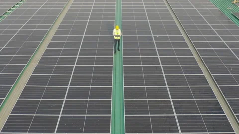 Aerial top view of engineer man or worker,people, with solar panels or solar  Video stock 151295704