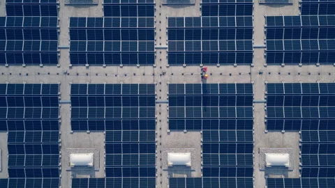 Aerial top view of engineers walking on solar panel installation Stock Footage 278671958