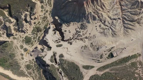 Aerial top view of eroded desert gullies and farmland edge 스톡 동영상 343324392
