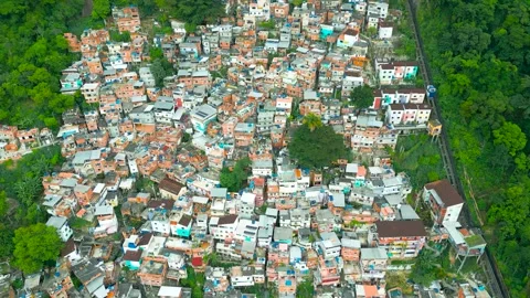 Aerial top view of a favelas densely populated urban area in Rio de Janeiro with Stock Footage 283471068