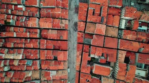 Aerial Top View Featuring Beautiful RedTiled Rooftops Alongside a Vibrant Marina Stock Footage 320750288
