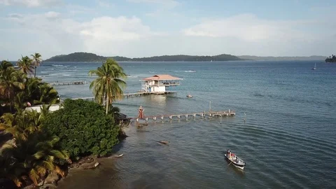 Aerial: top view fly over of Fishermen fishing Ocean from boat Stock Footage 98895938