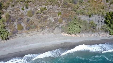 Aerial top view flying from ocean to greenhouses Vídeos de archivo 337320520