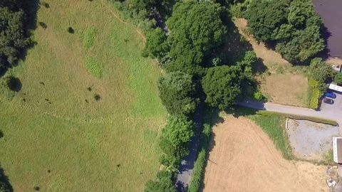 Aerial Top View, flying over countryside roads with driving cars, Devon, Stock Footage 97241633