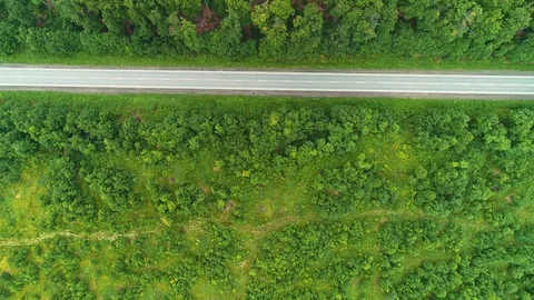 Aerial top view of freeway and the cars, moving quickly, doing their business Stock Footage 109940990
