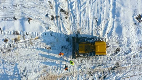Aerial top view of a group of power lineman operates with caterpillar tractor Vídeos de archivo 103100892