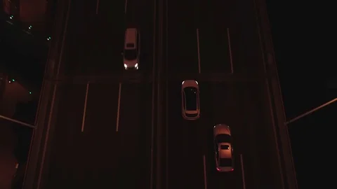 Aerial top view of highway interchange at night. Aerial top view of road Video stock 104834213