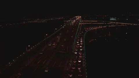 Aerial top view of highway interchange at night. Aerial top view of road Stock Footage