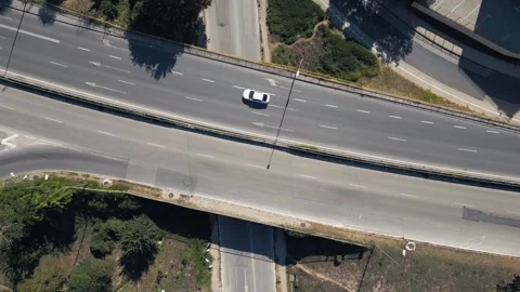 Aerial Top View of Highway Overpass Bridge Road with White Car Driving Stock Footage 346699401