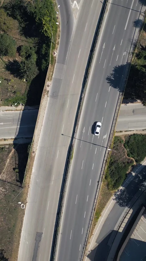 Aerial Top View of Highway Overpass Bridge Road with White Car Driving Stock Footage 346699801